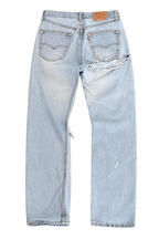 Le Pétite Jean W31 L32 denim jeans showing classic fit, light wash, and detailed stitching on the front and back pockets.