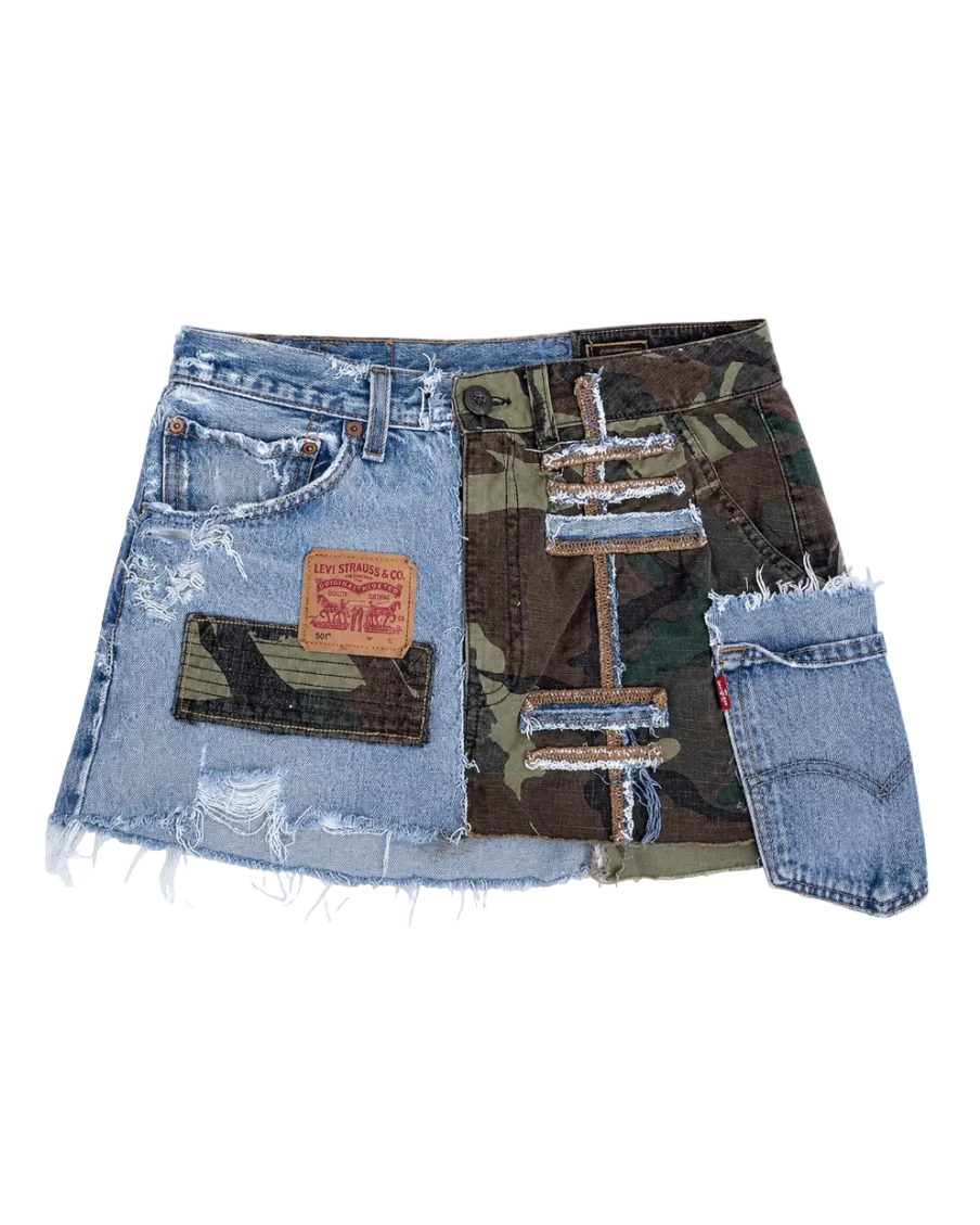 A distressed denim mini skirt featuring a patchwork design with light blue frayed denim, a camouflage print panel, and a brown leather Levi's patch on the front pocket.