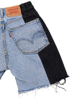 Le Pétite Jean W26 shorts, casual denim style with front pockets and distressed details, shown on a hanger.