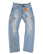 Le Pétite Jean W31 L32 jeans with classic denim look, visible stitching, and five-pocket design on a neutral background.