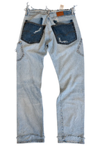 Le Pétite Jean W31 L32 denim jeans showing classic fit and dark wash with visible stitching and pocket details.