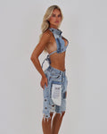 Le Pétite Jean After Hour Jorts in blue denim, showcasing stylish, casual shorts with a relaxed fit and frayed hem.