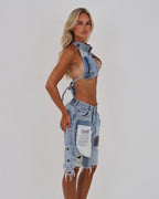 Le Pétite Jean After Hour Jorts in blue denim, showcasing stylish, casual shorts with a relaxed fit and frayed hem.