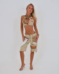 Le Pétite Jean beige after hour halter crop top bralet displayed on a model, showcasing the stylish design and fit.