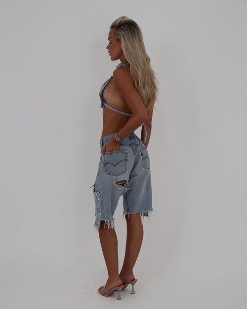 Le Pétite Jean The After Hour Jorts denim shorts with distressed details and frayed hem, model wearing casual summer shorts.